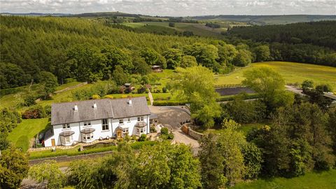 Forest Lodge stands as a magnificent and substantial rural estate, graced with extensive manicured gardens and outstanding equestrian amenities, encompassing approximately 12 acres of stunning gardens and paddocks. This property exudes a striking con...