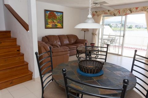 Located in Jolly Harbour. Villa 403E is situated on the North finger of Jolly Harbour with fabulous views across the marina. This 2 bedroom 2 and a half bathroom villa is very tastefully furnished with downstairs featuring nice leather couches beauti...