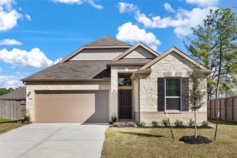 KB HOME NEW CONSTRUCTION - Welcome home to 41502 Stampede Stream Drive located in Mustang Ridge and zoned to Magnolia ISD! This floor plan features 3 bedrooms, 2 full baths and an attached 2-car garage. Additional features include stainless steel Whi...