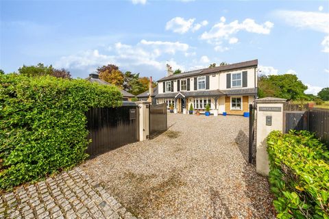 A truly delightful, refurbished and extended 4-bedroom (previously 5 bedrooms) family home approaching 3,000 sq ft, set beyond security gates on a highly desirable, secluded plot in this semi-rural location. Entering this stunning home, one is greete...