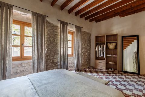 Welcome to a Mallorquin townhouse that has been reformed with great care and attention to detail. The house displays a sober combination of materials and colors and with three bedrooms, three bathrooms and a plunge pool this home makes a perfect holi...
