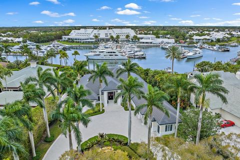 This Spectacular Admirals Cove Estate Home on the Spyglass Lane cul-de-sac has a captivating wide-water view of the mega-yacht marina and nationally-acclaimed clubhouse, viewed through a 16-ft. wall of glass! The interior dimensions are equally breat...