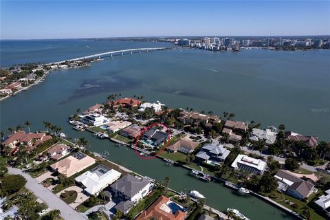 Introducing the epitome of waterfront luxury in the highly sought-after Bird Key community. Prepare to be captivated by the sheer grandeur of this remarkable property, complete with an expansive, 100-foot-long deep-water dock. It is Meticulously desi...