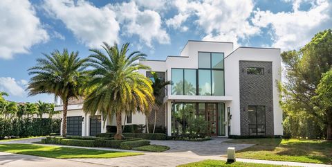 Epitomizing modern elegance, this stunning, five-bedroom masterpiece, built in 2019, meticulously maintained, and boasting 7,868 +/- total square feet, offers the ultimate in luxury coastal living. Making a breathtaking first impression immediately u...