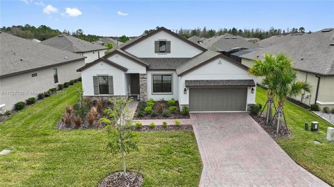 Welcome to your dream home in this spectacular 55+ community IN POINCIANA, FL. This turnkey, nearly brand-new 3-bedroom, 3-bath home is a stunning example of modern living with 2,274 sqft of beautifully designed space. Built in 2022, it offers a fres...