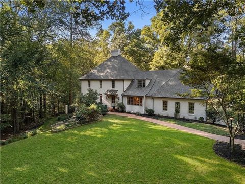 Nestled at the end of a peaceful cul-de-sac in the coveted Winterthur Estates, this captivating custom-built home offers an unparalleled living experience, tucked away from view and enveloped in natural beauty. Resting on 2.56 acres near the serene b...