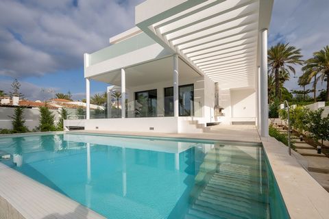 LOCATION LOCATION This contemporary villa situated just 50 meters from the pristine beaches of Marbesa within the soughtafter Marbella area boasts an exquisite layout The lower level spans 223 square meters and features a threecar garage storage spac...