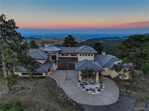 Magnificent Mountain Estate first time on the market. This unique custom executive home is conveniently located for the busy professional seeking a spectacular mountain retreat just 20 miles from the hustle and bustle of Downtown Denver. A true 