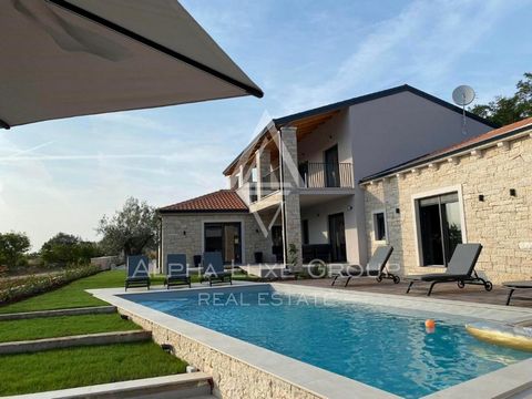 ALPHA LUXE GROUP is selling a luxury villa with a wellness oasis surrounded by greenery with a sea view, Tinjan, ISTRIA It is in a quiet area surrounded by beautiful nature, five kilometers from the city center and only 15 minutes from Poreč. The vil...