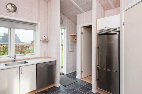 Holiday home by Flovt Strand with combined living room and kitchen with wood burning stove and alcove. From here there is access to a partially covered terrace. In the garden there is a swing and sandbox for the children. There are two double bedroom...