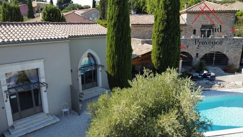 Prestigious property in a small village of Provence, located on a closed ground of 2150m2 out of sight. Composed of a main stone part of 243m2 and 3 cottages of 54m2 each. The main part, on two levels, offers on the ground floor, a living room, 4 bed...
