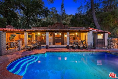 Welcome to an extraordinary opportunity to own exclusive acreage in the breathtaking neighborhood of Monte Nido, previously graced by legendary artists. Tucked away on a private 5+ acre parcel, this Spanish serene retreat is a haven for those in sear...