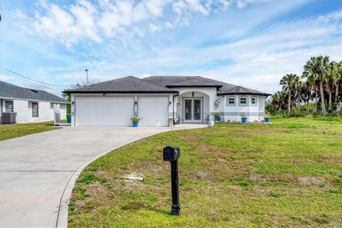 Welcome home! This meticulously maintained TURNKEY 3-bedroom, 2-bathroom pool home is a piece of paradise that could be yours. Inside you'll find an open concept that features a well-lit living room, dining area, and kitchen all in one. Interior is c...