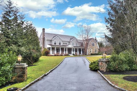 Experience the epitome of luxury living in this exquisite colonial residence situated on a serene cul-de-sac in Greens Farms. Boasting over 1.5 acres of picturesque surroundings, this stunning home welcomes you with a grand covered veranda leading in...