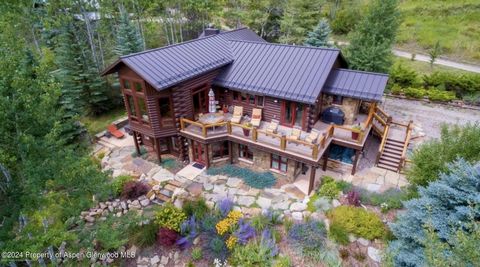 The quaking aspen and lush gardens surrounding this elegant log home lend privacy and a 'treehouse feel'. Situated to best enjoy vast views of the Crystal River Valley with Mt. Sopris looming to the north, this beautiful 3 bedroom, 3 bath home has be...