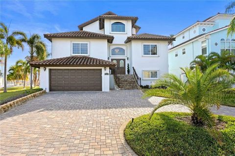 WOW!!!!! The only word to sum up this stunning waterfront, pool home. Everything has been redone and is ready for its new owner. Located on Madeira Beach with DEEP water access, this boaters dream has 4 bedrooms PLUS and an office and tons of BONUS s...