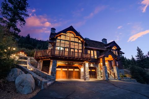 Welcome to this exquisite mountain home nestled near the ski hill. Offering breathtaking views of KT, Red Dog, and the entire valley, this property embodies timeless design, blending indoor and outdoor living seamlessly. Step into the cathedral-like ...