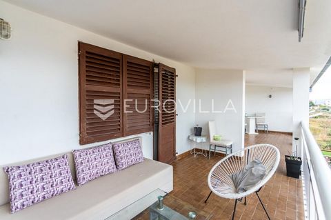 Podstrana, comfortable apartment located on the second, top floor of a small apartment building. South orientation with partial sea view.The apartment has 75 m2 of closed area and together with the associated secondary parts (loggia, courtyard and ga...