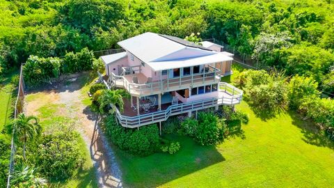 If you love sunsets over the water .... here is an exciting opportunity to live within walking distance of St. Croix's renowned west end's white sand beaches and calm turquoise waters! Live upstairs, or downstairs and vacation rent the other, or shar...