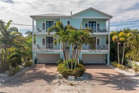 Discover a coastal paradise in this magnificent 4-bedroom, 3.5-bath half-duplex home, ideally located in Bradenton Beach just steps from the Gulf of Mexico, where unobstructed ocean views greet you at every turn. The open and spacious floor plan is t...