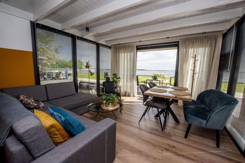 This energy-efficient houseboat is made of sustainable materials and equipped with 12 solar panels. The tastefully furnished houseboat has windows on all sides that offer views over the popular Sneekermeer. The houseboat is moored in the Waterrijck m...
