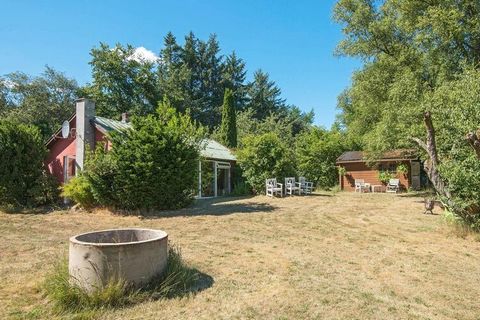 A modernised old farm building located in a scenic area, close to the river of Gudenåen. There is a small pathway that leads to the river, where you find a terrace with a table, bench and canoe at your disposal (use at your own risk). The house is th...
