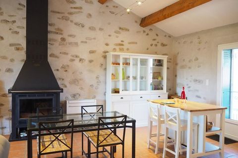In a very quiet setting, next to olive trees, surrounded by the mountains of Orb, lies this tastefully furnished stone country house. It consists of a bright living and dining area with open kitchen, two cosy bedrooms and a bathroom with shower and t...