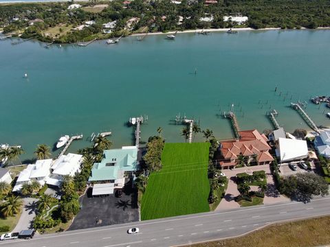 (ZONING: R3A, FUTURE LANDUSE: COM/OFF/RES)If you are considering building in the Jupiter-Tequesta area on deep blue water within minutes to the Jupiter Inlet with beautiful views and no fixed bridges, this is a must see. The dock is new including com...