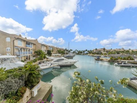 This middle floor two bedroom home is located on the lagoon-front overlooking the Sunset Isle The Caribbean. This homethat lends itself to the lifestyle at Port St Charles. The spacious master bedroom is beautifully decorated, with a large bathroom t...