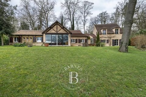 BARNES Yvelines is listing a beautiful house offering 344m² (3,703 sq ft) of living space over two levels, set on a 2,524m² (27,168 sq ft) plot planted with trees in a leafy setting in L'Etang-la-Ville. 20m² (215 sq ft) outbuilding also included. Gro...