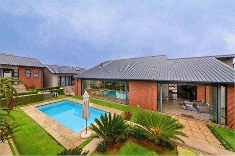 This completely off the grid 2823m2 home with a separate two-bedroom flatlet, offers a unique and creative lifestyle with connectivity to the irrigated landscape being fundamental to its core design.  An expansive sweeping forecourt with four-car aut...