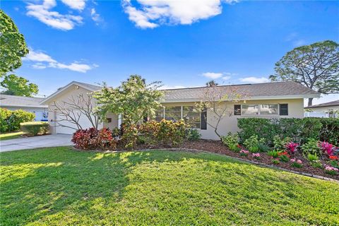 Welcome HOME to your very own slice of waterfront paradise! Solid block construction - this newly renovated home offers 3 beds, 2 baths, 2 car garage, nearly 1800 SFT, split floor plan, gleaming terrazzo floors, screened-in back patio, and so much mo...