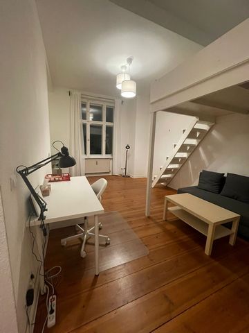 The lovely apartment is located on the first floor of a beautiful historic building, overlooking a quiet and spacious courtyard. The apartment features a large room with high ceiling and a loft bed, a comfortable double sofa bed, a built-in wardrobe,...