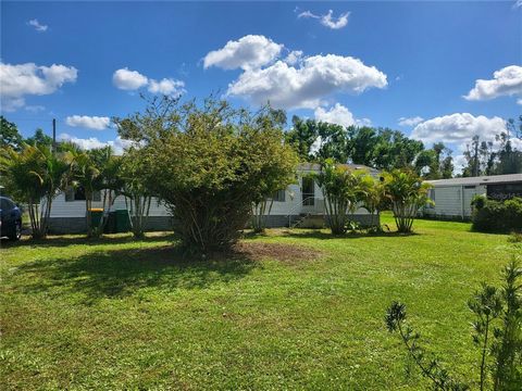 Welcome to 6128 Padula Street, a two bedroom, two bathroom split plan single wide manufacture home nestled in the Alta Vista community (no HOA or deed restrictions) in Punta Gorda. This charming property offers the epitome of Florida living this home...