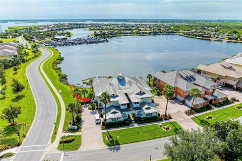 Enjoy waterfront living in this bright, beautifully finished, 3-bedroom carriage-style home located at The Lagoon, a prestigious 24-hour gated community in desirable Tidewater Preserve on the Manatee River. Formerly a model home and situated on a pre...