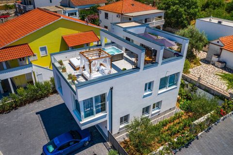 Location: Ciovo Built: 2022 Ciovo center: 0.7 km Sea: 0.4 km Airport distance: 10 km Inside space: 180 m2 Plot size: 391 m2 Bedrooms: 3 Bathrooms: 3 Parking: 5 Air-conditioner Cameras Patio Garden Features: - Washing Machine - Terrace - Furnished - A...