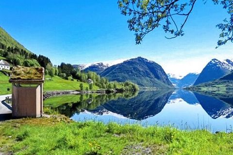 One of two beautiful holiday homes by the water with beautiful views to high mountains and beautiful villages. Holiday home no. 06773 is seen from behind to the right towards the water. Live only 5 m from Jølstravatnet, Norway's most fish-rich trout ...
