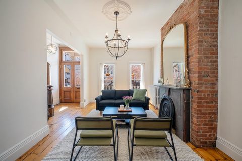 Built in 1885, this 1,528 sf home is situated on a quiet street in the highly desirable Heights neighborhood boasting a picturesque restored façade with blooming cherry blossom tree, original historic charm with modern updates, driveway parking and b...