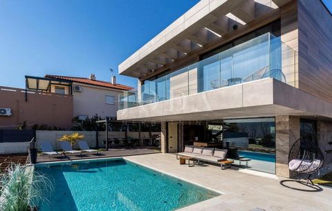 Location: Primorsko-goranska županija, Baška, Baška. Beautiful, modern urban villa with pool for sale in Baska on the island of Krk! In a quiet location, close to the city center and the beach, there is this impressive villa. Carefully and luxuriousl...