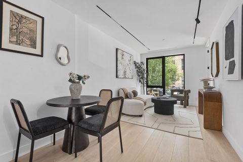 Welcome to a truly extraordinary townhouse residence, where refined elegance meets contemporary design. Accessible through an exclusive private-floor entrance, this remarkable duplex offers an elevated main floor above street level, providing a rare ...