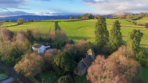 A former Vicarage on the fringe of a popular village, offering a combination of privacy and community. Positioned on a quiet lane, and within short walking distance of the local church, chapel and village hall. This spacious and light much loved fami...