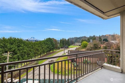 Experience breathtaking Mt Rainier & WS golf course views from almost every room in this rare 3BD, 2BA Luna Court condo! Thoughtfully updated in 2025, this home features fresh paint, new flooring, light fixtures, updated baths & more. Floor-to-ceilin...