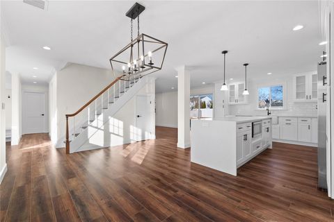 Welcome to 33 Cannon Dr! This expansive 5BR 3BA home showcases a modern open-concept living design! This impeccably renovated and unique barn-style residence offers a generous amount of living space, office space, and is perfect for hosting large gat...