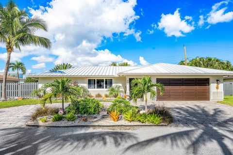 Welcome to 819 South Road in Boynton Beach, FL. Located in an exclusive waterfront community, this single-family home comes with two deep water boat slips. The tastefully renovated home is bright and airy with an open kitchen and family room. The pri...