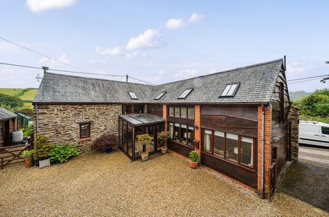 A superb detached barn conversion located in a pretty village on the edge of The Exmoor National Park set in large gardens with garage, parking and enjoying wonderful rural views over farmland. Sympathetically converted from farm buildings in 2003, t...