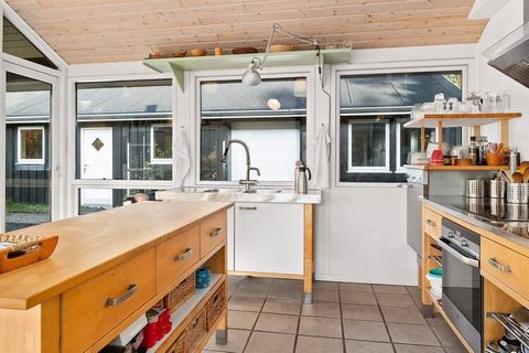Holiday home with whirlpool located within walking distance to the water and on a large natural plot in the middle of the forest at Als Odde. Large and bright living room in open connection with kitchen and dining area with large windows facing the g...