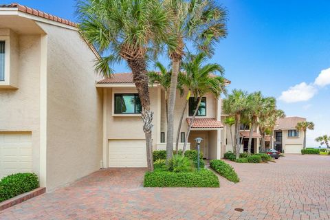 Experience the epitome of coastal luxury at Dunes of Ocean Ridge! This spectacular and exclusive gated beachside community of only 36 homes steps from the Ocean delivers this stunning 3 bed, 2.5 bath two-story townhome with an unparalleled blend of m...