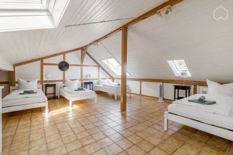 The Attic (Spitzboden), etends over two floors with a total of 3 rooms and bathroom. The large Living-dining area with open Kitchen forms the heart of the attic, here you can play, cook and end the evenning comfortably, adjoining is a room with 3 sin...