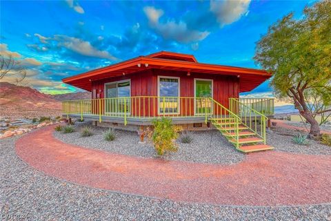 Nestled atop a 1.8-acre oasis, this octagon-shaped mid-century modern gem, built in 1966, offers an unparalleled panoramic view of Lake Mead, Black Mountain, El Dorado Valley, and DT Boulder City. Boasting 1,804 sq ft, 2 bedrooms with ensuite bathroo...