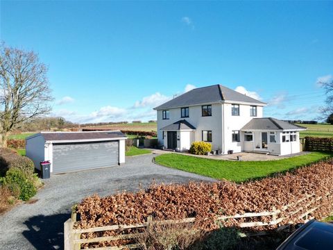 Nestled in a picturesque location with breathtaking views of the rugged Brecon Beacons, this expansive 4-bedroom modern family home is set within nearly 2 acres of gardens and grounds. Just 2 miles from Brecon, it offers an ideal setting for those de...